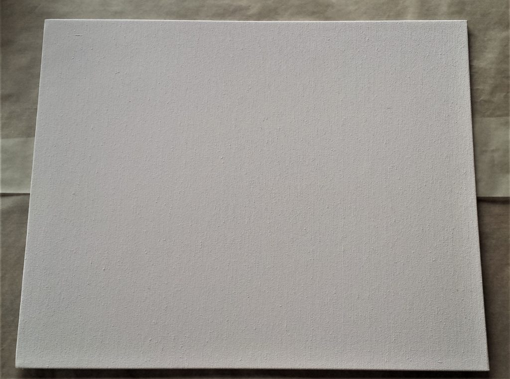 Baking Paper on the table to protect it, the Canvas on top of the baking paper.