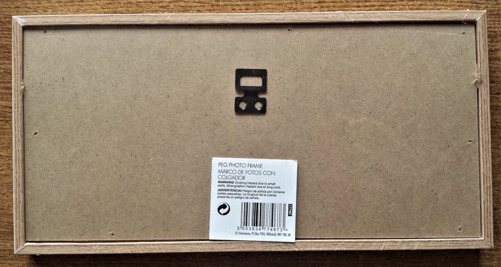 Back of the wooden frame with the staples removed.