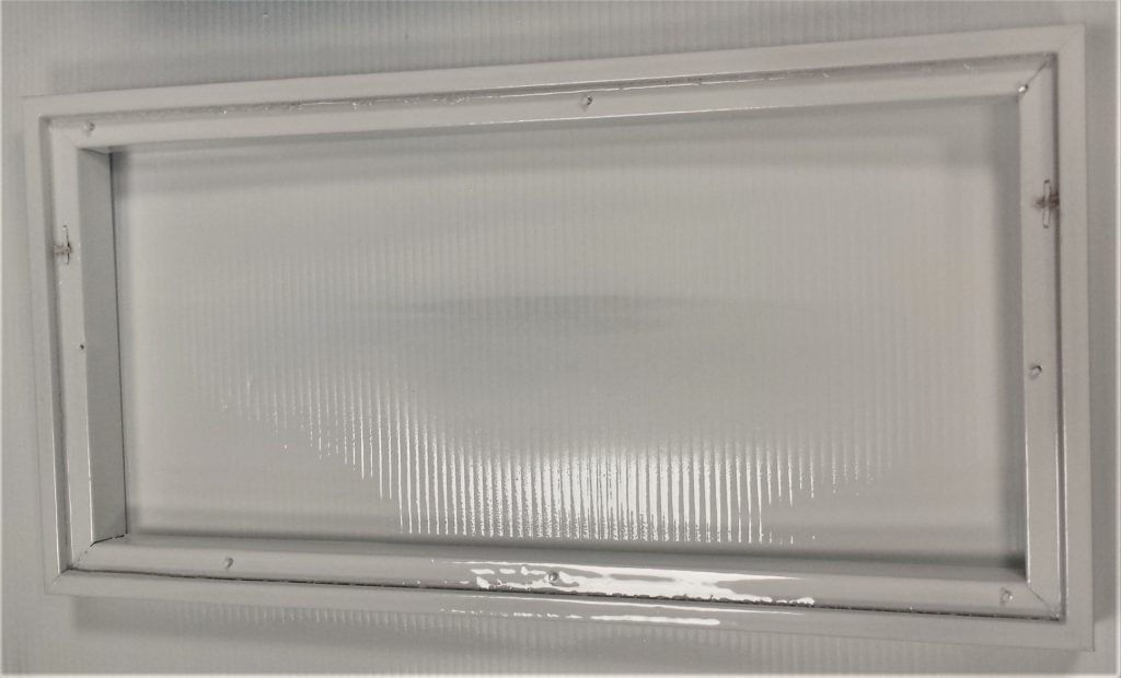 Final layer of spray paint applied to the back of the frame.