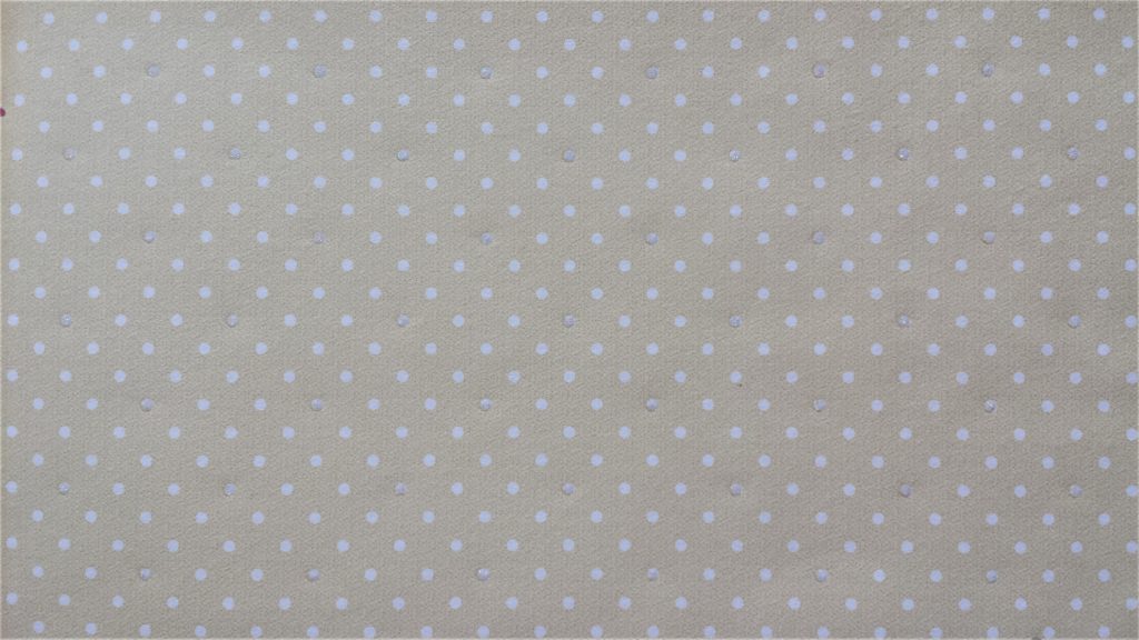 Close up of the yellow and white polka dot page.