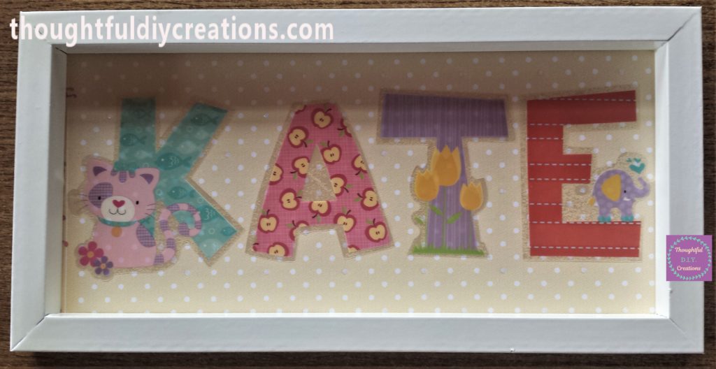 Each sticker stuck to the polka dot paper in the frame.