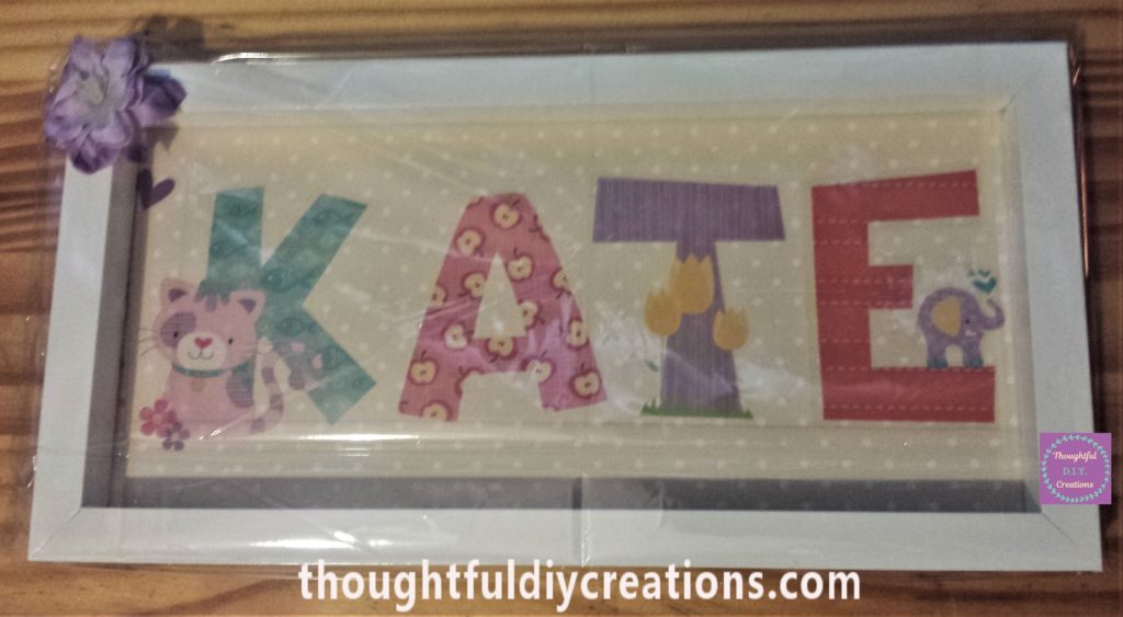 Frame wrapped in clear cellophane to present it to the recipient.