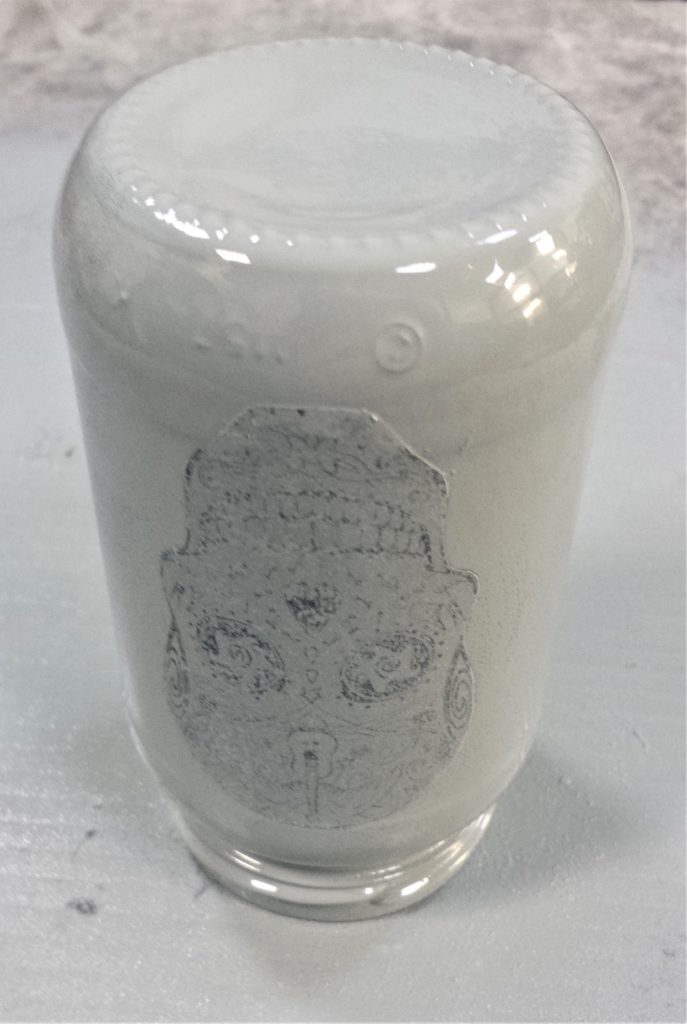 One layer of spray paint on the whole jar.