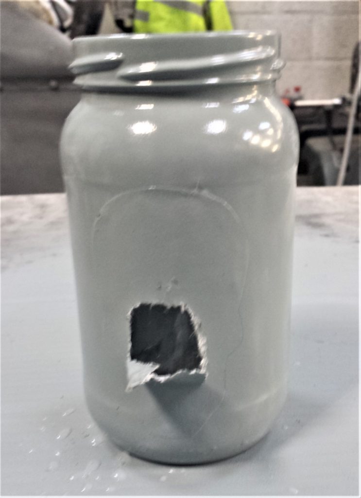 Starting to remove the skull picture from the jar.