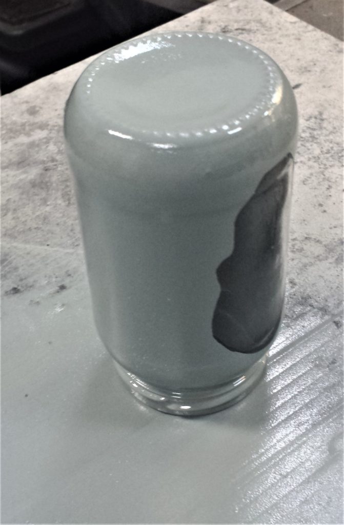 Second layer of clear gloss sealant on the jar.