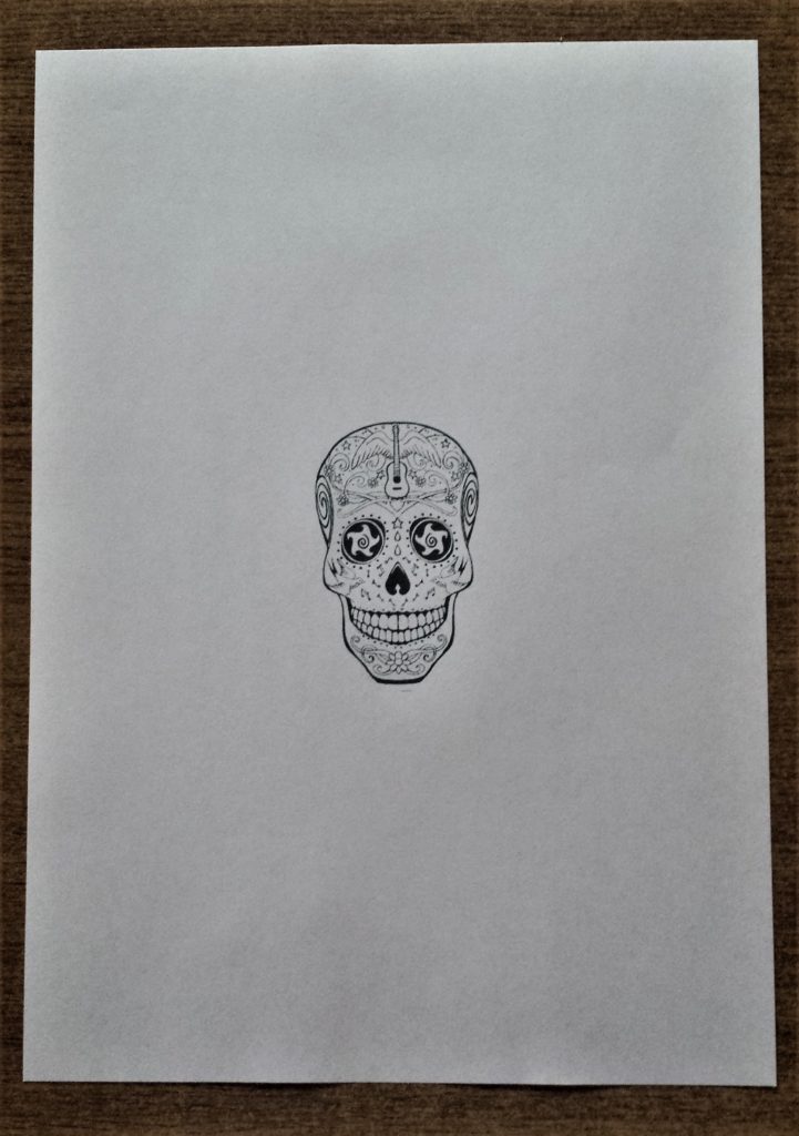 The skull image printed out on regular printer paper.