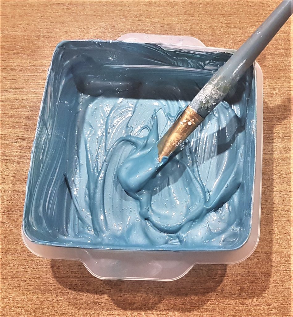 The teal colour I achieved from mixing all the paints together.