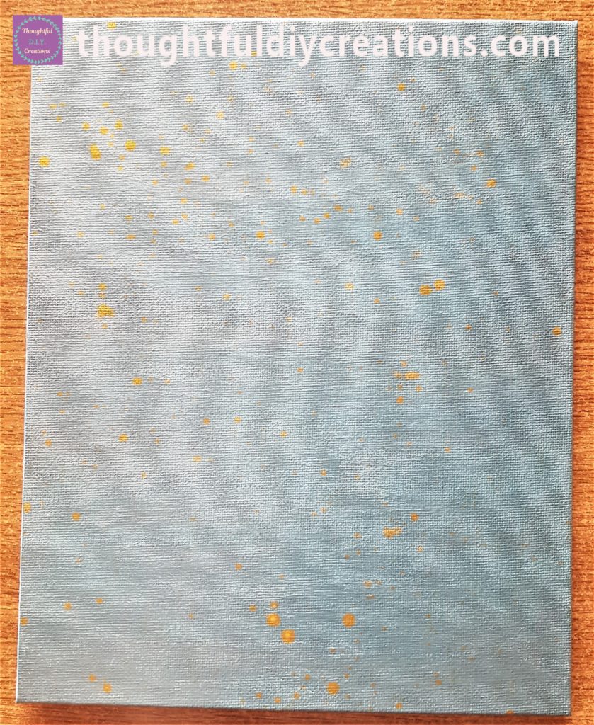 Gold splatters on random parts of the canvas.