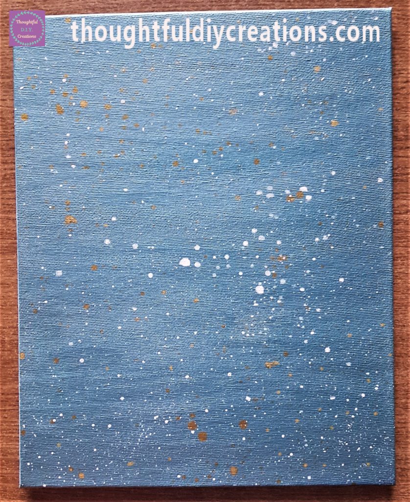 White splatters added to the canvas board.