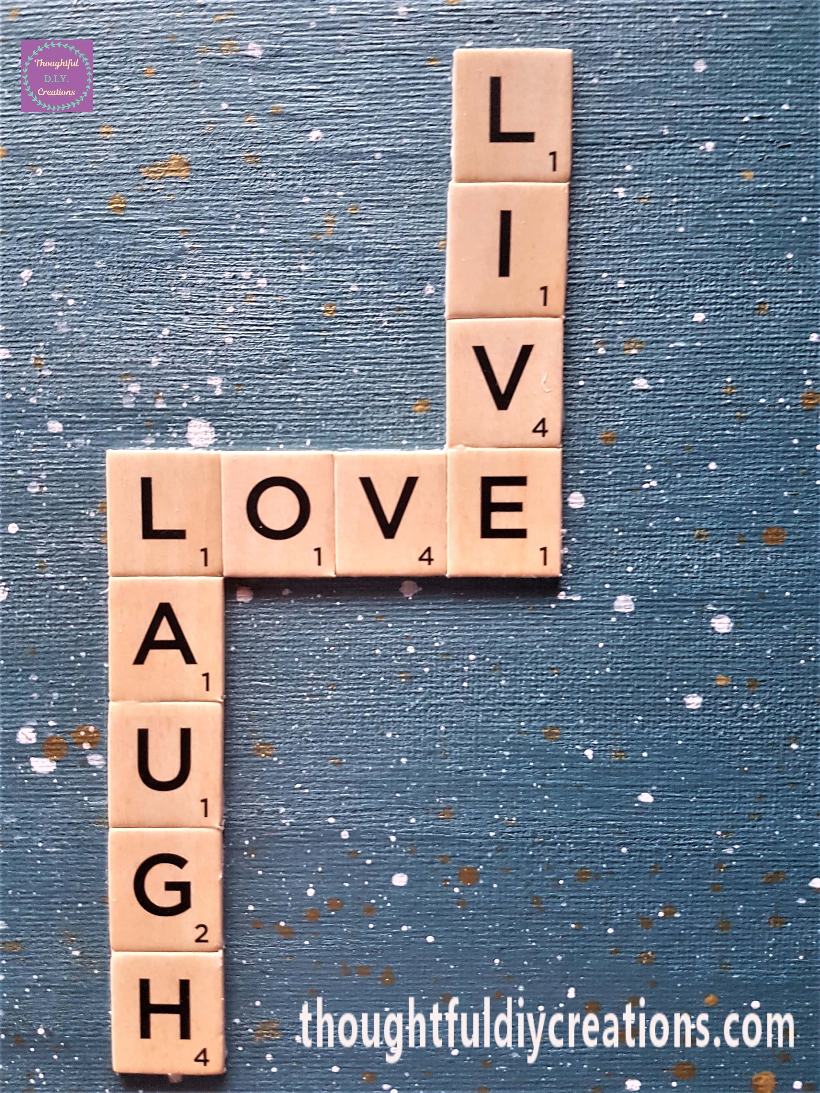 Close up image of the 'Live, Love, Laugh' Sentiment on the Canvas.