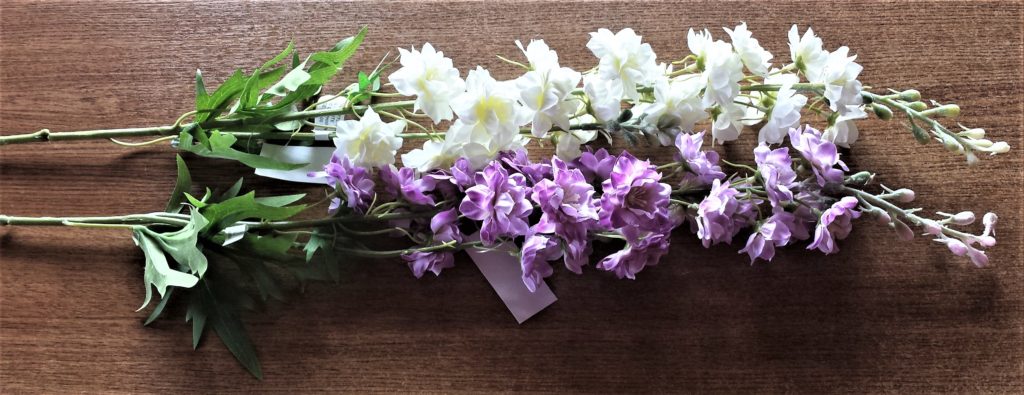 Purple and cream artificial flowers.