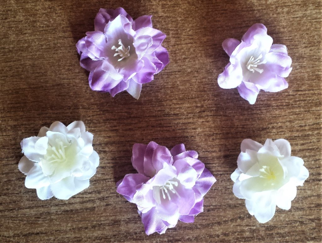 A few flower heads pulled from their stems from each colour of flowers.