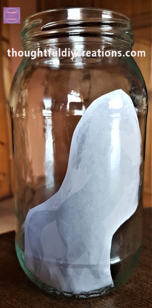 The Horse Silhouette Image glued to the inside of the jar.