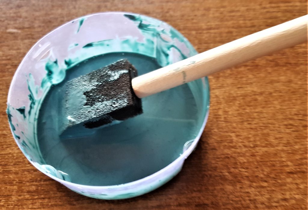 Water added to the paint and mixed together.