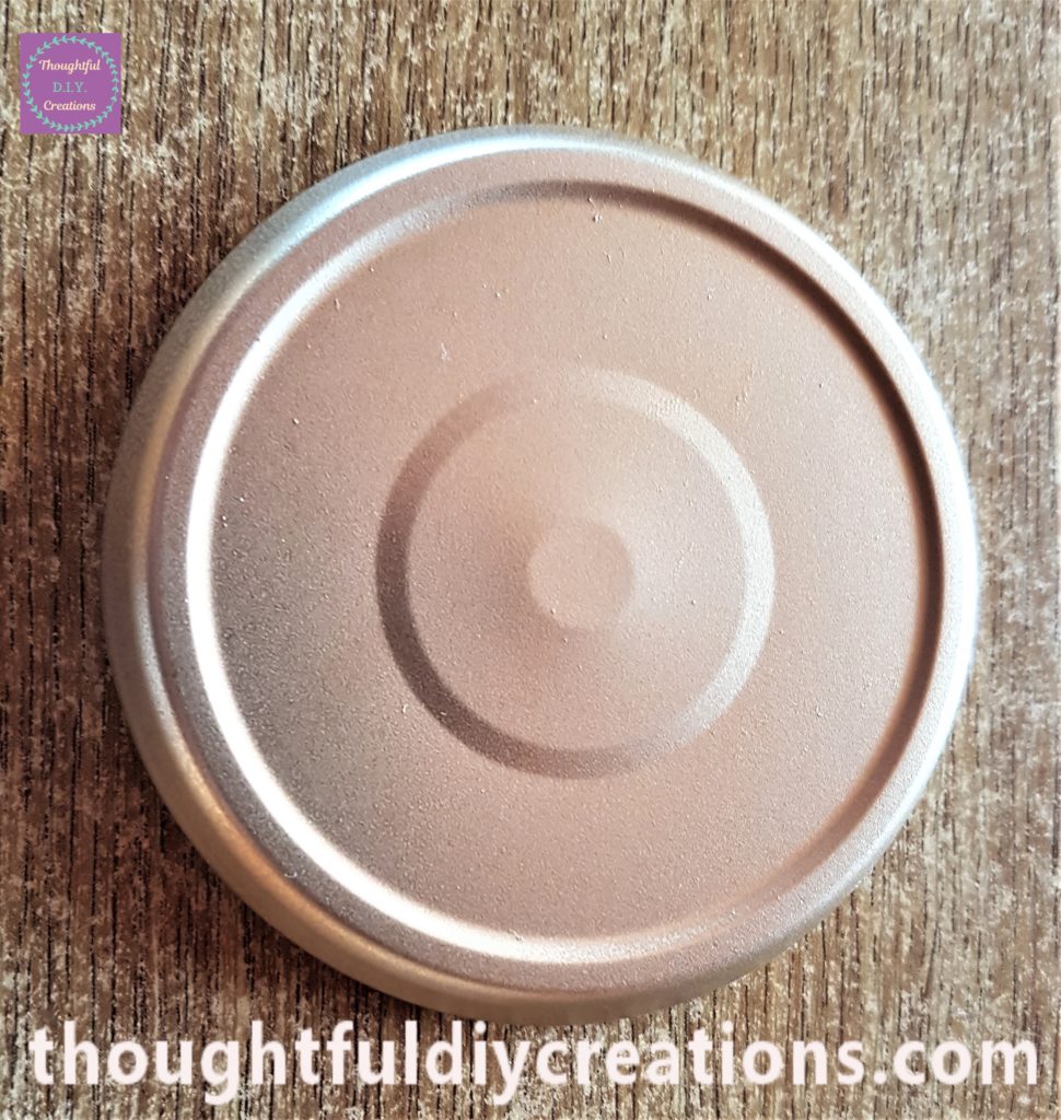 The spray painted lid brought inside from the shed.