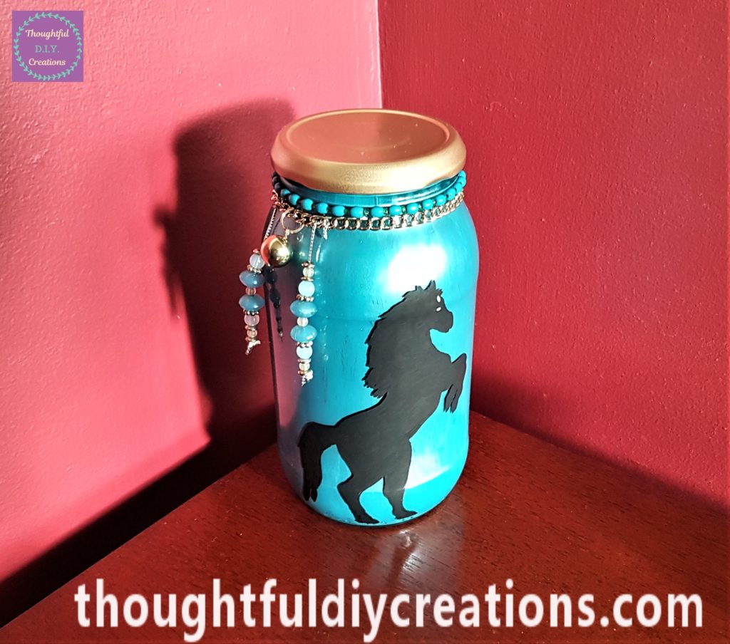 Horse Silhouette Jar on a Table.