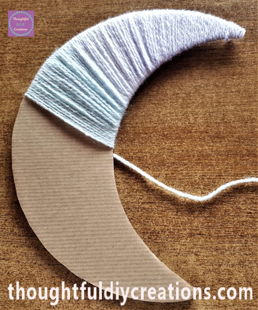 The light green shade in the wool starting to show wrapped around the moon.