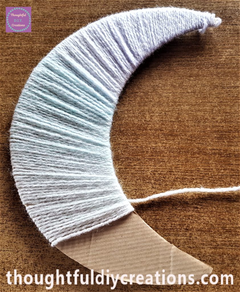 The peach shade of the wool visible in the photo.