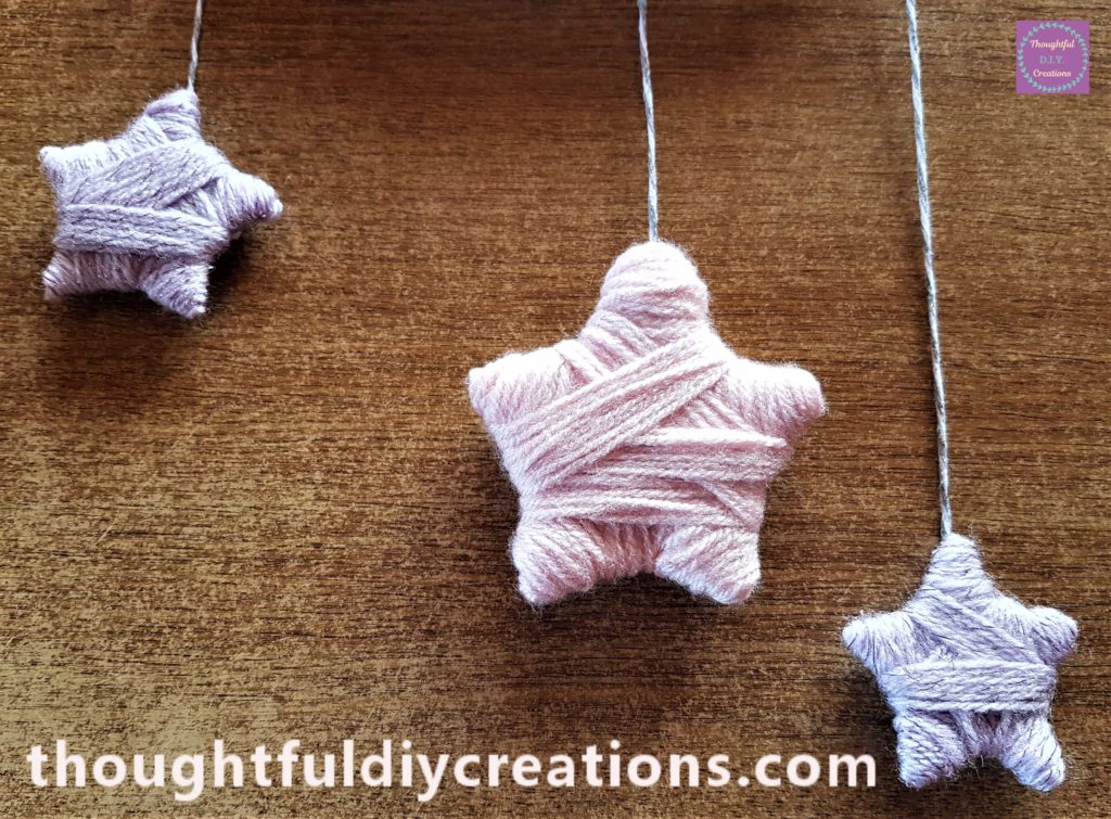 Close up image of the 3 stars and string.