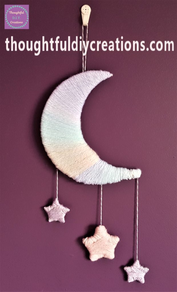 Wool moon and stars up on the wall.
