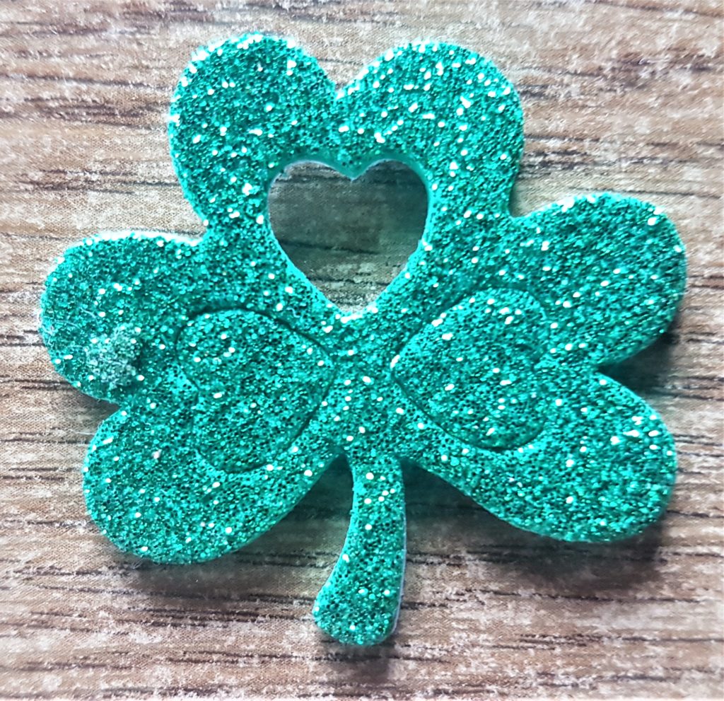 The heart sticker removed from the darkest green foam shamrock.