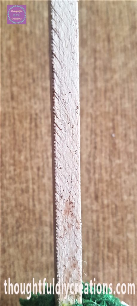 Gold glitter eye liner added to all 4 sides of the wooden stick.