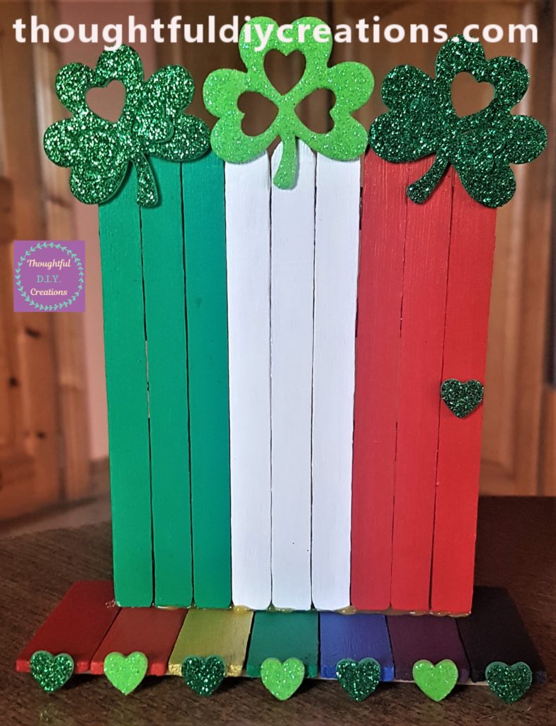 The leprechaun door hot glued to the rainbow path.