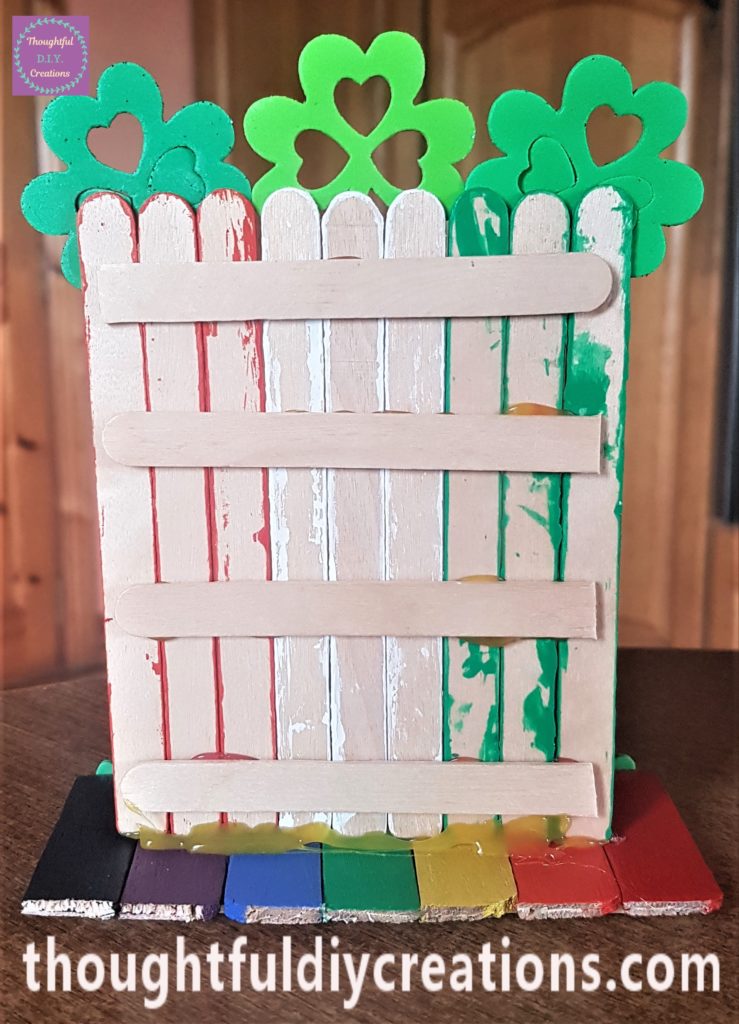 The back of the leprechaun door hot glued to the rainbow path.