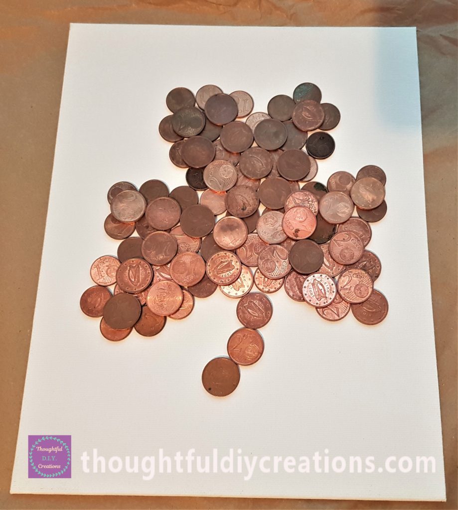 1 Cent and 2 Cent coins in the shape of a Shamrock on the Canvas Board.