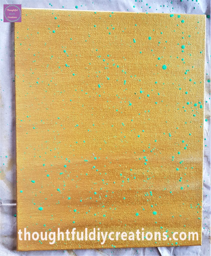 Close up image of the green splashes added to the canvas.