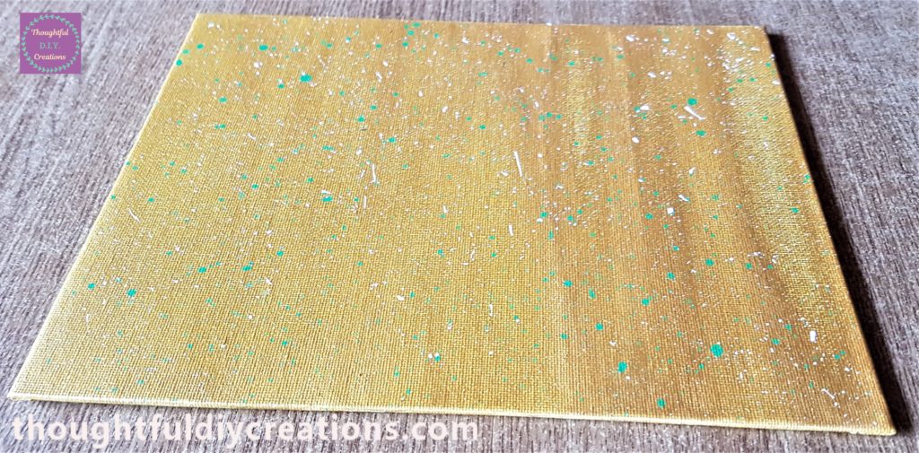 White splashes added to the canvas board with gesso and water.