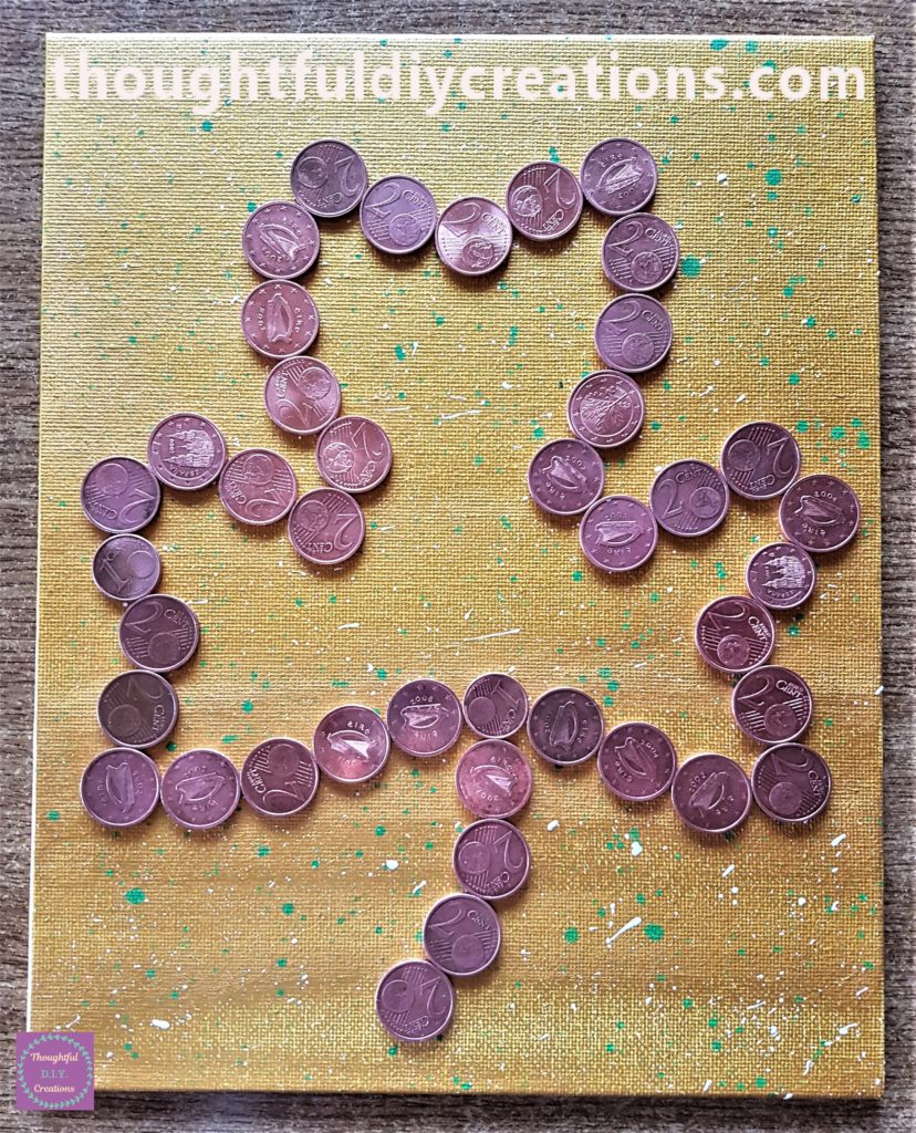 I practiced the outline of the shamrock with the coins on the canvas board.