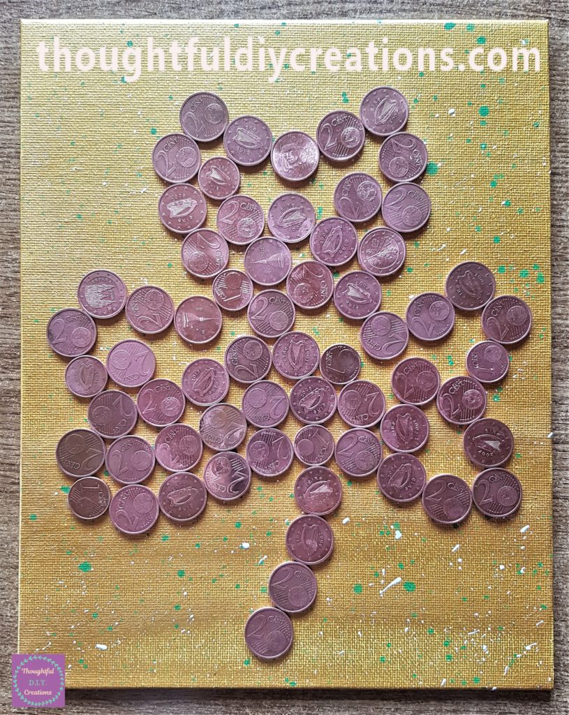 The inside of the shamrock filled in with coins.