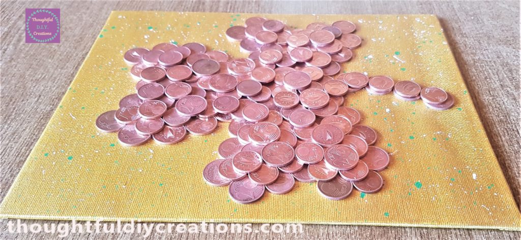 Another side view of the canvas showing the different layers of coins.
