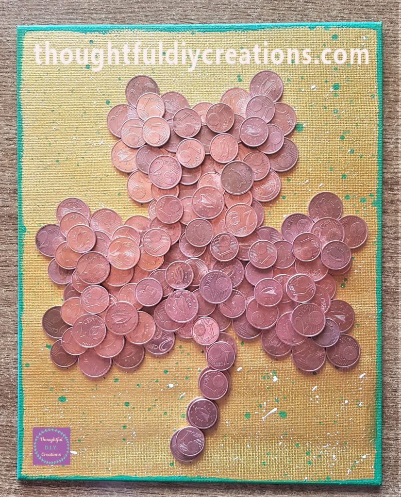 Green acrylic paint added to the edges and side of the canvas with my finger.