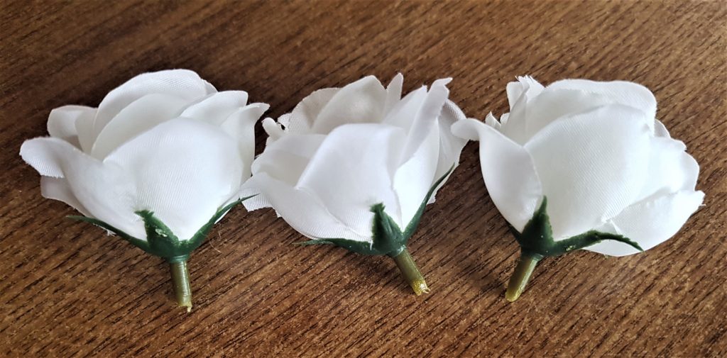 The back of the 3 artificial flowers.
