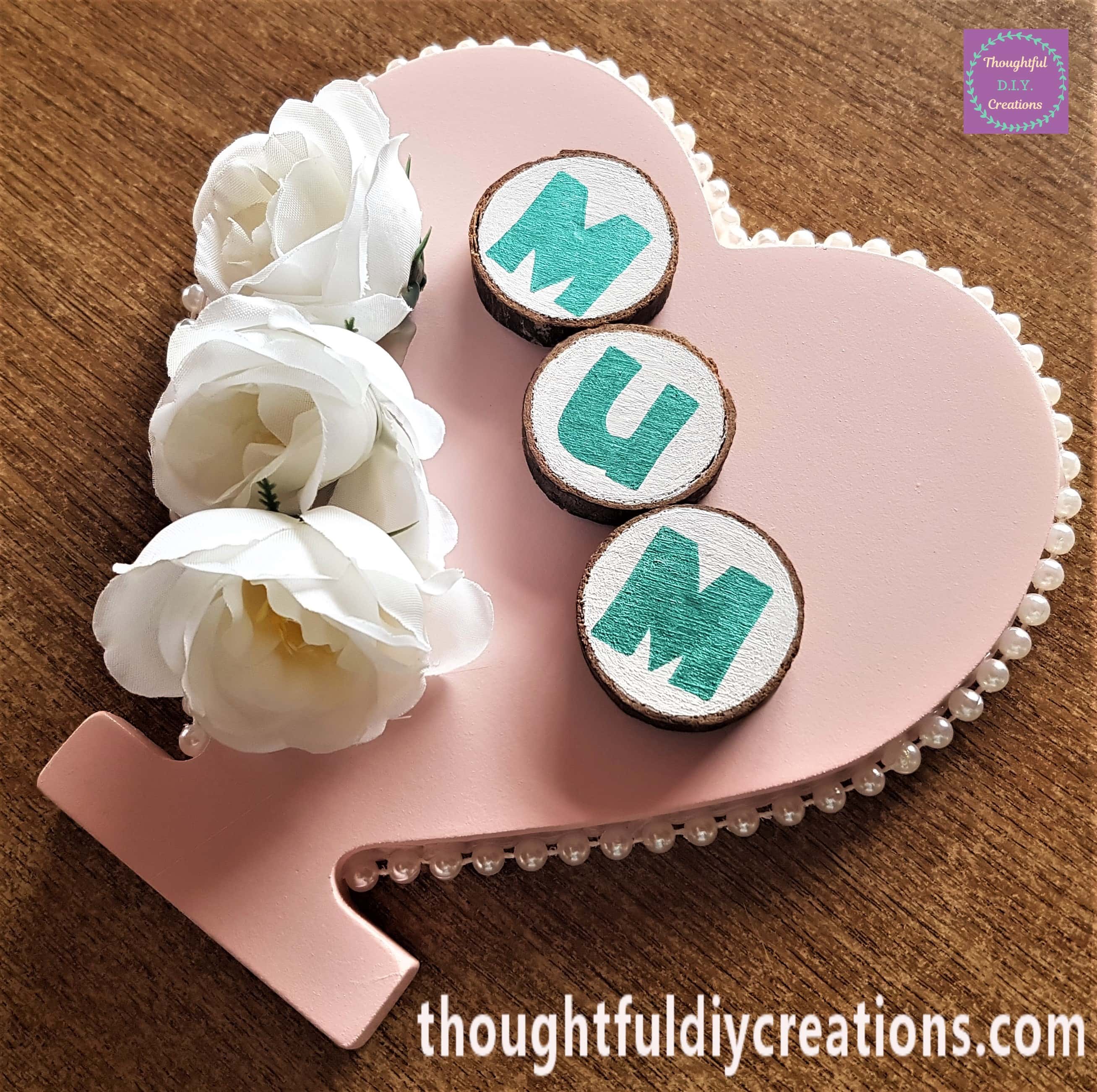 Another image of the wood slices hot glued to the heart.