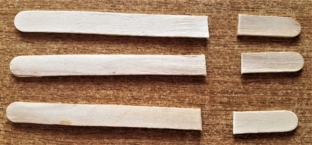The 3 natural lollipop sticks all cut the same size.
