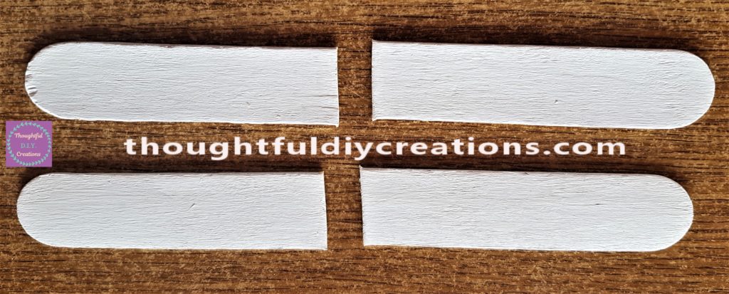 The 2 wider lollipop sticks cut in half.