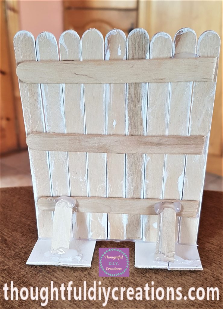 Full view of the back of the Easter Bunny Door with cut lollipop sticks hot glued on for added support.