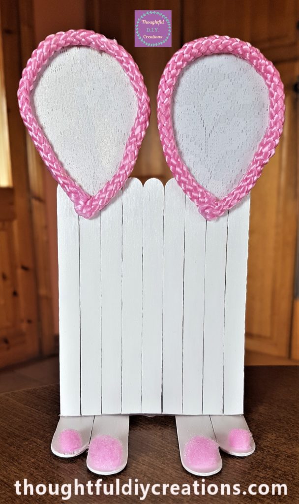 Hot glue added to the back of the Bunny Ears and attached to the top of the Easter Bunny Door.