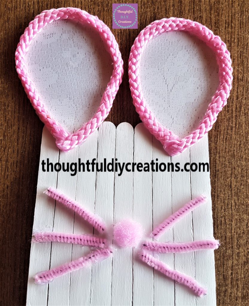 The pipe cleaners hot glued to the Easter Bunny Door for whiskers.