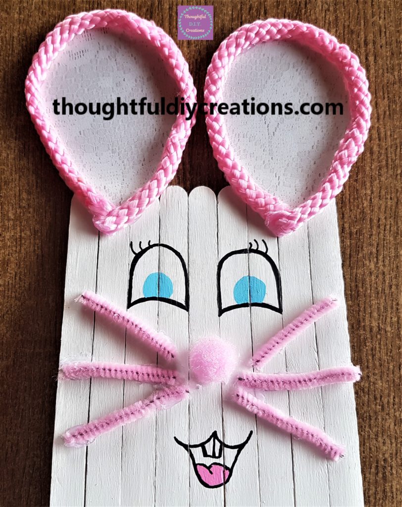 Close-up image of the Bunny face done with paint pens.