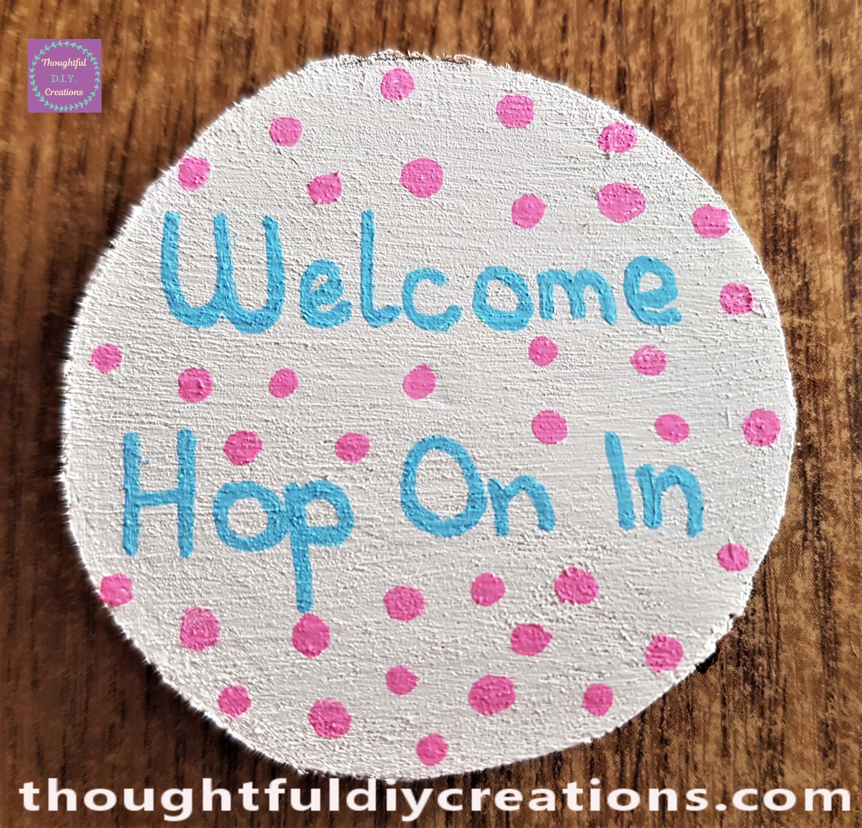 Pink dots added all around the wood slice with the pink paint pen.