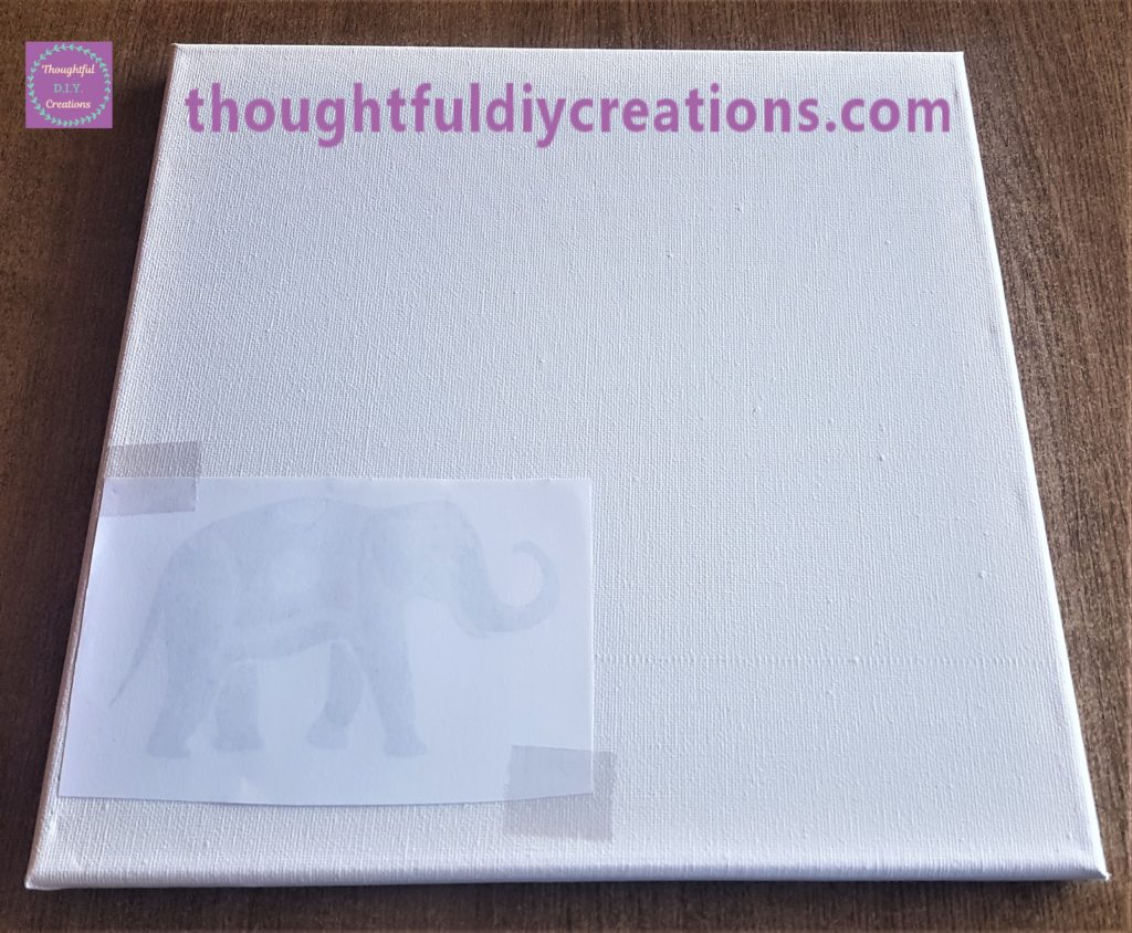 The Elephant image facing down on the bottom of the canvas  with sellotape on the top and bottom to hold it in place.