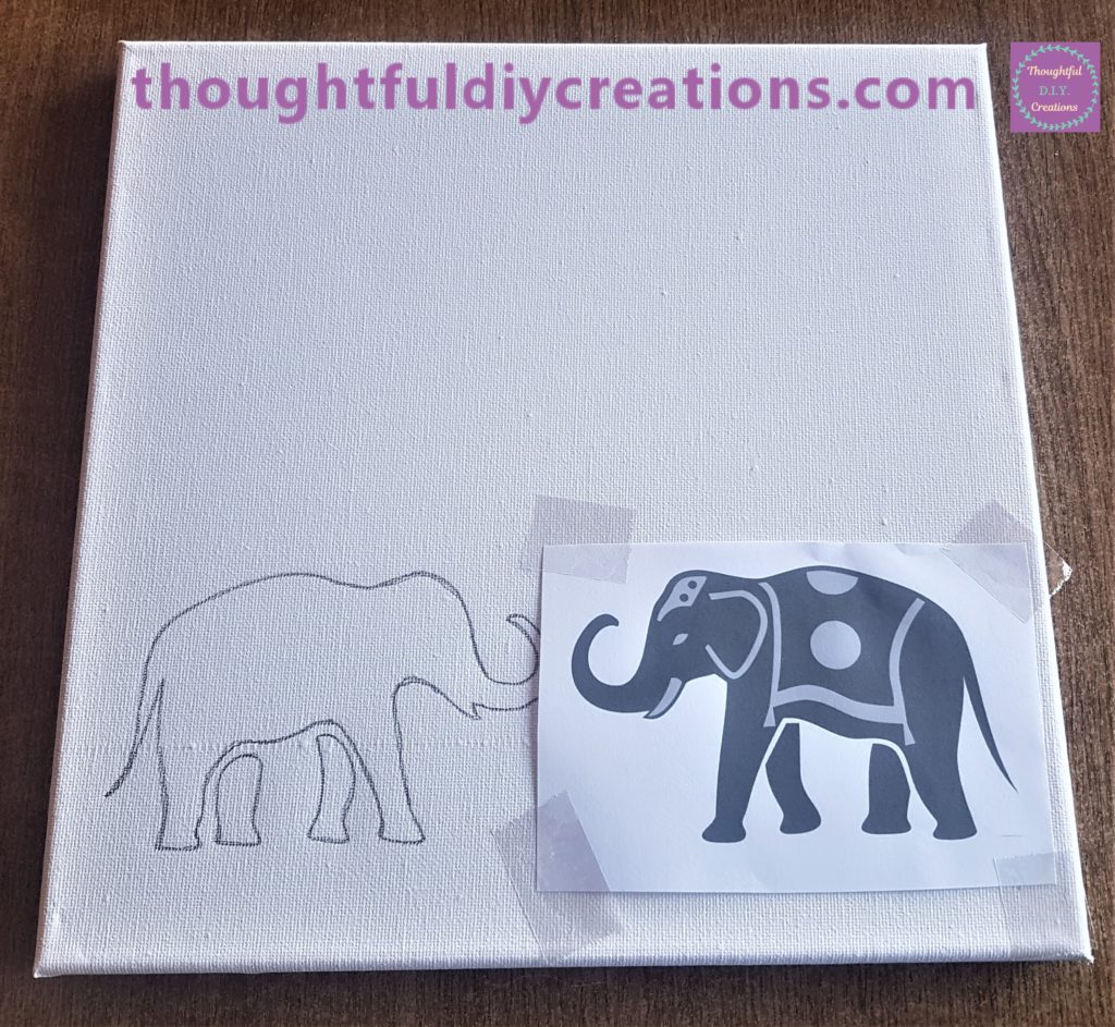 The other Elephant image sellotaped to the Canvas facing upwards facing the other elephant.