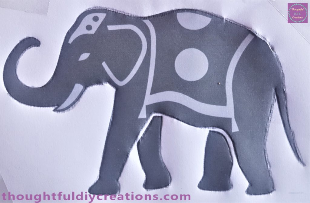 I traced around the outline of the elephant twice with a dark pencil.