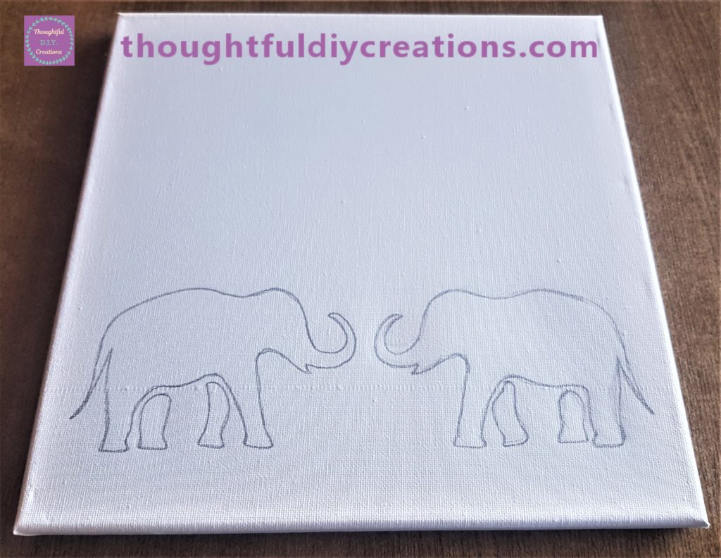 I removed the image and traced around the outline on the canvas with the pencil.