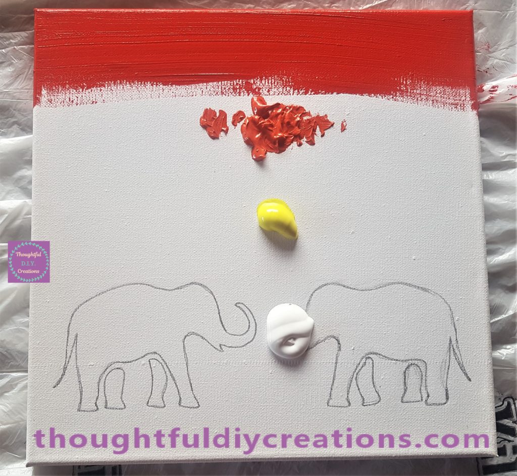 Red paint spread across the top of the canvas with the paintbrush.