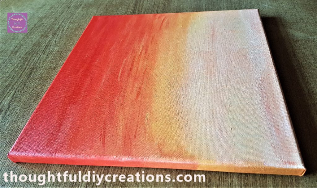 Side view of the painted sunset canvas.